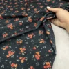 مخمل کبریتی زمینه مشکی گل نارنجی