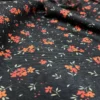 مخمل کبریتی زمینه مشکی گل نارنجی